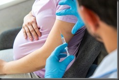 A pregnant woman makes a vaccination. Selective focus.