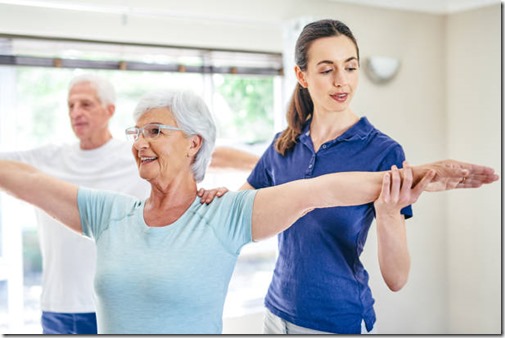 Shot of an instructor assisting a senior woman in a fitness class